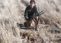 KB  with a coyote harvested using the  R-15 chambered in .204 Ruger. 2012 